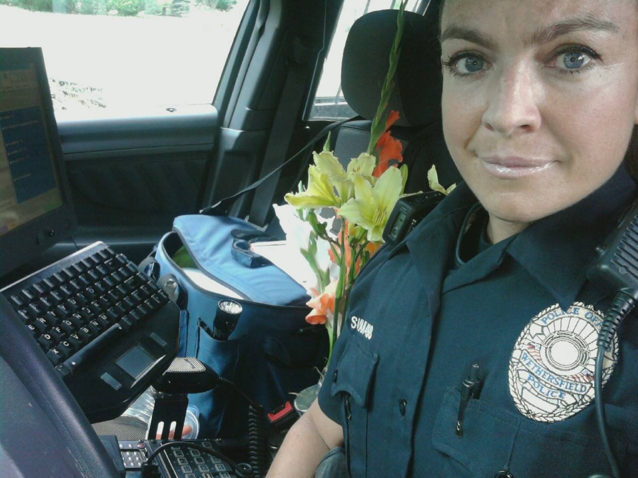 A police woman in a car